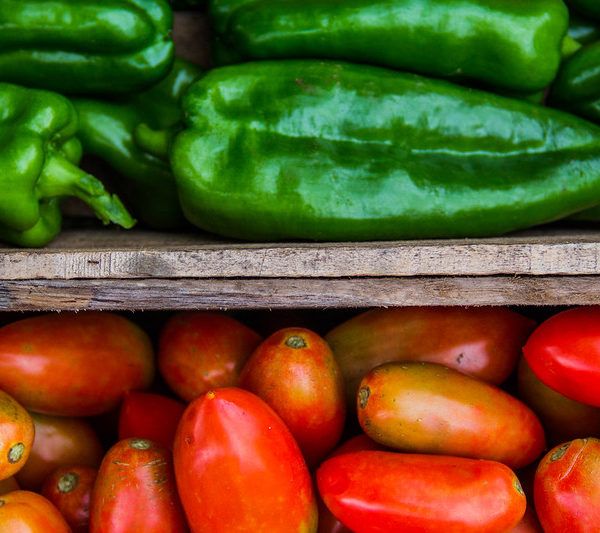 Macro of Crates with Tomatoes and Bell Peppers