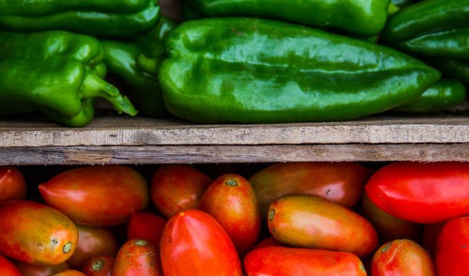 Macro of Crates with Tomatoes and Bell Peppers