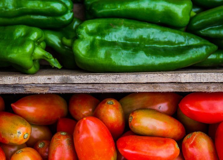 Macro of Crates with Tomatoes and Bell Peppers